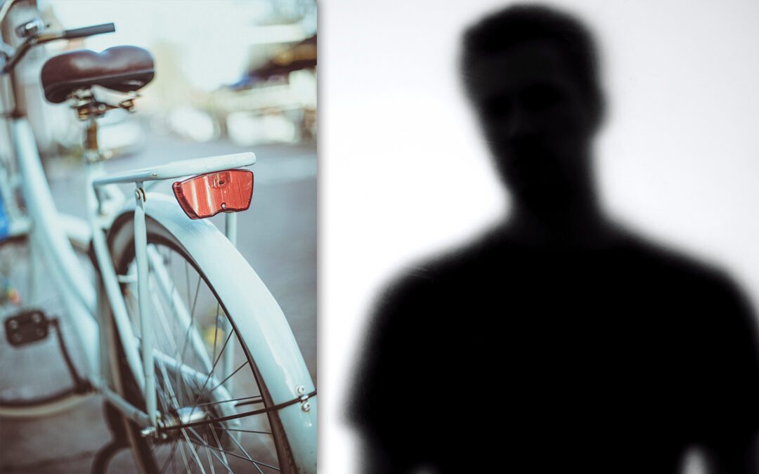 Cykel och en mörk siluett.